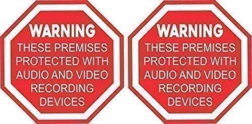 A pair of warning signs that are in red.