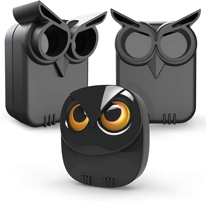 A group of three owl shaped speakers sitting next to each other.