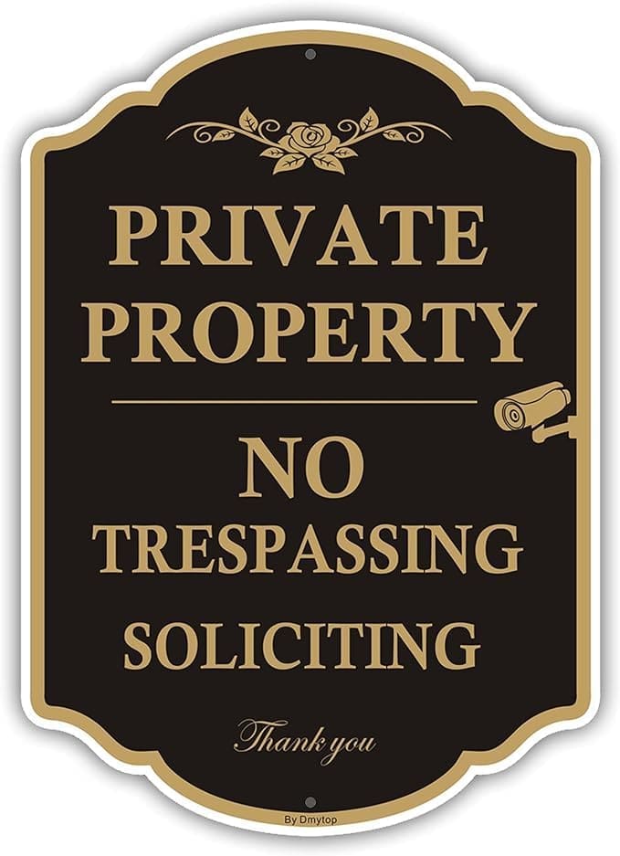 A sign that says private property no trespassing soliciting.