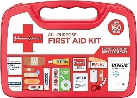 A red first aid kit with all the contents in it.