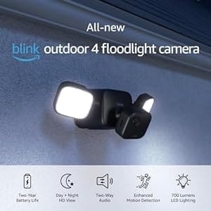 A black outdoor floodlight camera with two lights.