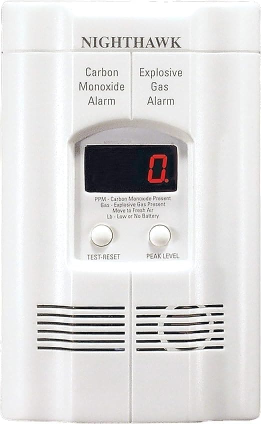 A white gas alarm with red digital display.