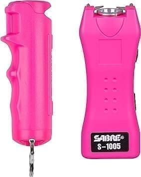 A pink device with a handle and a button